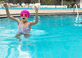 Girl swimming and playing in pool