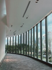 Urban View Through Curved Glass Windows