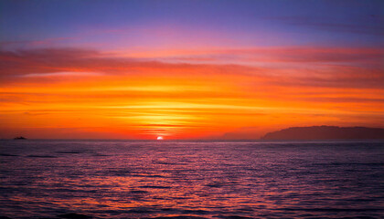 Fototapeta premium Ocean-Sunset-Gradient-Hues ,A vibrant sunset over the ocean with a gradient of orange, pink, and purple hues reflecting beautifully on the water.