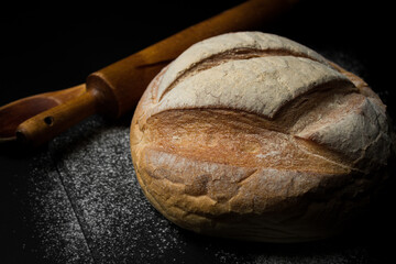 Freshly baked bread on a dark background. Fresh baked goods