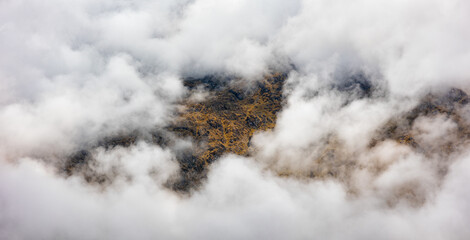 Mountain through the clouds in Peru
