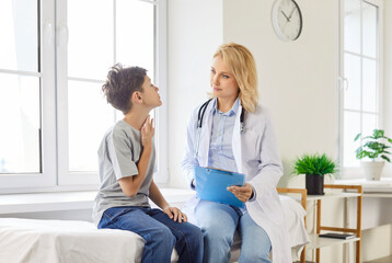Family physician, pediatrician and child boy complaining suffering with sore throat, tonsillitis...