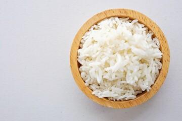 Cooked white rice or steamed rice in a wooden bowl,  , thai jasmine rice, thai fragrant rice on white table