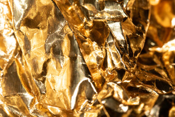 Jagged Crumpled and Creased Gold Shiny Metal Metallic Background