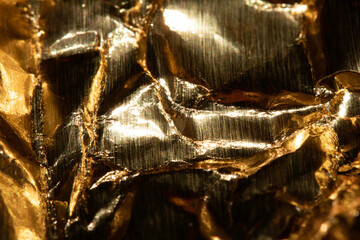 Jagged Crumpled and Creased Gold Shiny Metal Metallic Background