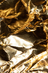 Jagged Crumpled and Creased Gold Shiny Metal Metallic Background