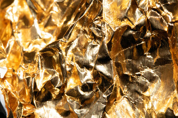 Jagged Crumpled and Creased Gold Shiny Metal Metallic Background