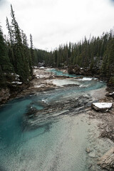 Fototapeta premium Natural Bridge in Yoho National Park, Alberta, Canada in winter. Turquoise colored water, landscape scenery background