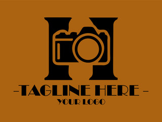 Camera inside large black H, suitable for photography concepts, graphic design, vektor, creative themes, and visual content with a modern touch