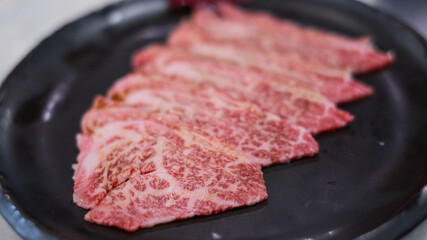 Premium marbled luxury sliced wagyu beef meat for yakiniku grilled steak sukiyaki