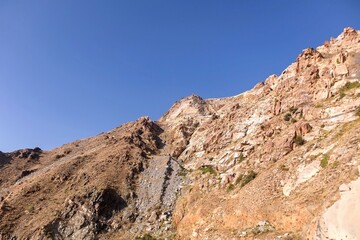 Fototapeta premium Rocky mountains landscape with clear blue sky in Taif city, Saudi Arabia