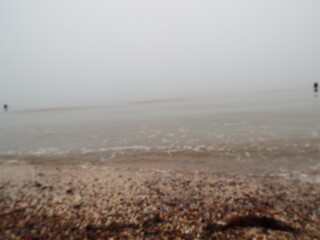 The sea and a shingle beach with the tide coming in waves