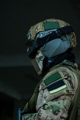 Close up soldier in full camouflage military gear