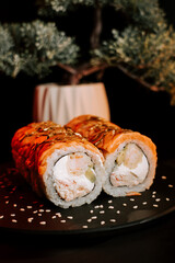 Fresh Sushi Rolls Plated on a Dark Background, Showcasing Vibrant Colors and Textures for an...