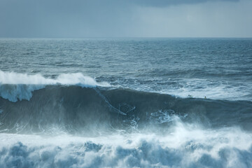 Fototapeta premium Surfer Riding a 20-Meter Giant Wave at Nazaré