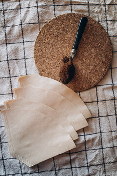 Coffee filters and spoon of coffee