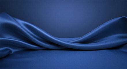 Deep blue silk satin fabric. Elegant abstract background. Liquid wave effect or silk with soft wavy folds. Beautiful navy blue fabric background with copy space for your design.