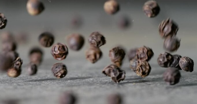 Peppercorns or black pepper spice. Super Macro Close Up. Shot on super slow motion camera 1000 fps.
