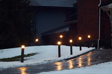 Illuminated Pathway in a Beautiful Winter Landscape Featuring Ambient Lighting and Tranquility