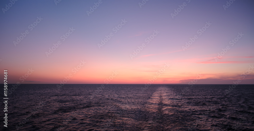 Aufkleber sunrise sun is setting over the ocean as beautiful backdrop for web page banner template. sky is bea