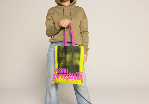 Customizable Tote Bag Held by Woman With Red Hair and Freckles. PSD mockup. Insert your design, your logo and change color from totebag and handles