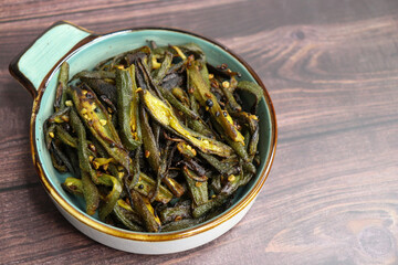 Bhindi Masala, stir-fried okra with Indian spices. Ladyfinger fry. Copy space. Bhendi ki sabzi.
