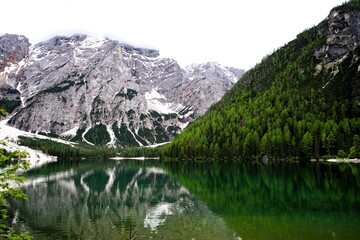 Fototapeta premium Beautiful landscape panorama of the Pragser Wildsee, Lake Prags, Lake Braies, Lago di Braies, Pragser Wildsee in the Dolomites in South Tyrol, Italy. Hiking and holidays in South Tyrol.