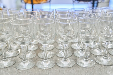 Top view of a row of empty, clear, clean wine glasses. With space to copy. High quality photo
