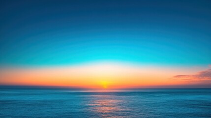 Fototapeta premium Idyllic view of blue sky and golden sunrise with unobstructed horizon