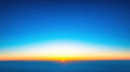 Fototapeta premium Panorama of clear blue sky at dawn with golden sunlight