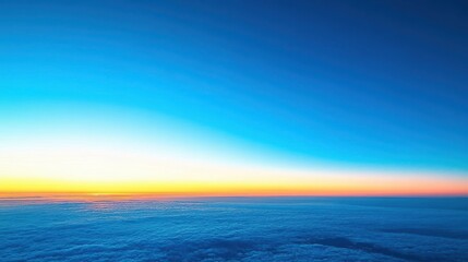 Obraz premium Panorama of clear blue sky at dawn with golden sunlight