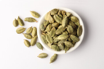  Cardamom in  ceramic bowl Cardamom is a common ingredient in Indian cooking. It is also often used in baking