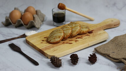 Delicious Serabi Cakes on Wooden Board with Honey