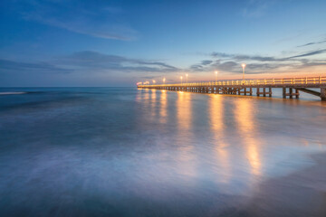 Obraz premium The pier of Forte dei Marmi at sunset. Versilia, Tuscany, Italy