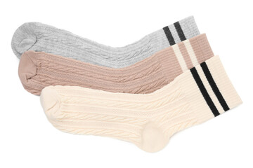 Different soft socks isolated on white, top view