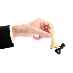 Man with white chess king knocking over black pawn on white background, closeup. Competition concept