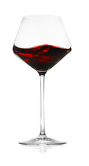 Red wine splashing in glass on white background
