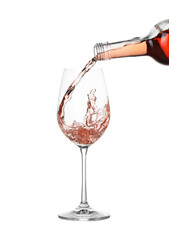 Pouring wine into glass on white background