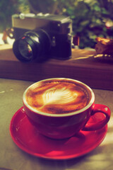 cup of coffee with vintage camera