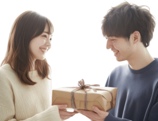 A young couple exchanging gifts, smiling and looking at each other, isolated on a white background for a romantic celebration