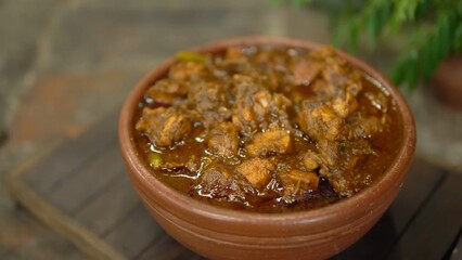 Indian Chicken Curry served on a table, featuring spicy chicken in rich gravy. A vibrant Indian dish ideal for restaurant menus, food displays, street food promotions, and commercial projects.