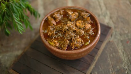 Indian Chicken Curry served on a table, featuring spicy chicken in rich gravy. A vibrant Indian dish ideal for restaurant menus, food displays, street food promotions, and commercial projects.