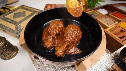 Indian Chicken Curry served on a table, featuring spicy chicken in rich gravy. A vibrant Indian dish ideal for restaurant menus, food displays, street food promotions, and commercial projects.