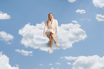 Beautiful young woman wearing a bathrobe and sleepers