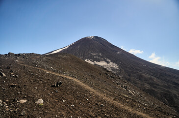 Fototapeta premium Avachinsky volcano. This stunning view of a majestic volcanic mountain showcases remarkable natural beauty and its rugged terrain