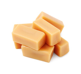 Tasty sweet caramel candies isolated on white