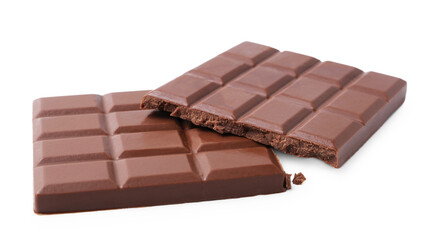 Pieces of delicious milk chocolate isolated on white