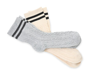 Different soft socks isolated on white, top view