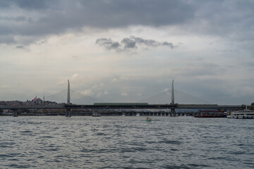Obraz premium View of the Metro Bridge, railway and pedestrian bridge spanning the Golden Horn in Azapkapi, Istanbul