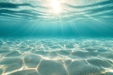 Beautiful sunlight filtering through the clear turquoise waters, illuminating the sandy ocean floor, creating a serene and tranquil underwater scene with gentle light rays and ripp